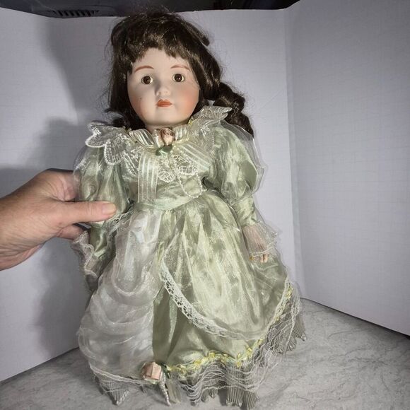 Heirloom Treasure Doll, Dark Long Curley Hair with Green Dress and Bow on Front - Picture 1 of 10